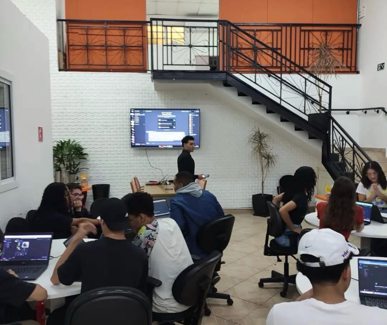 Participants using laptops during a class